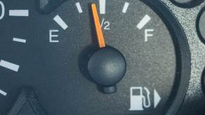 Black fuel gauge with white "E" and "F" letters on either end of the needle.