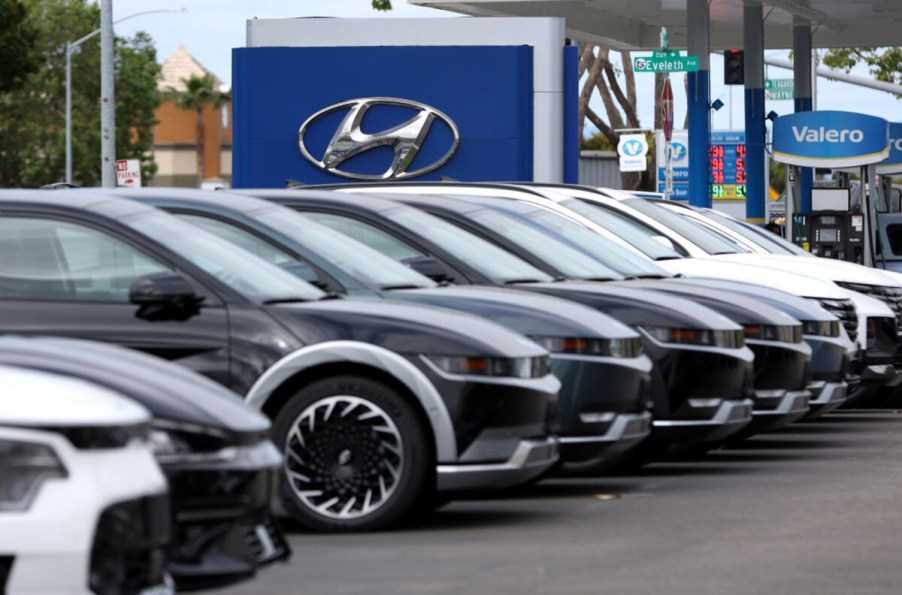 Hyundai cars at dealership with Hyundai logo in background