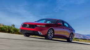 A red Honda Accord on display outside.