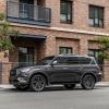 A 2023 Infiniti QX80 parked on a city street.