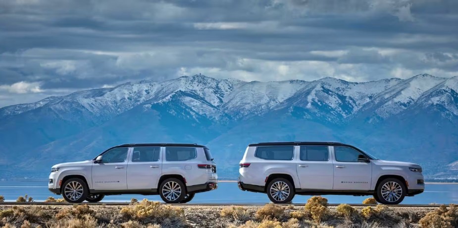 White Jeep Wagoneer and Grand Wagoneer full-size SUVs are parked. 