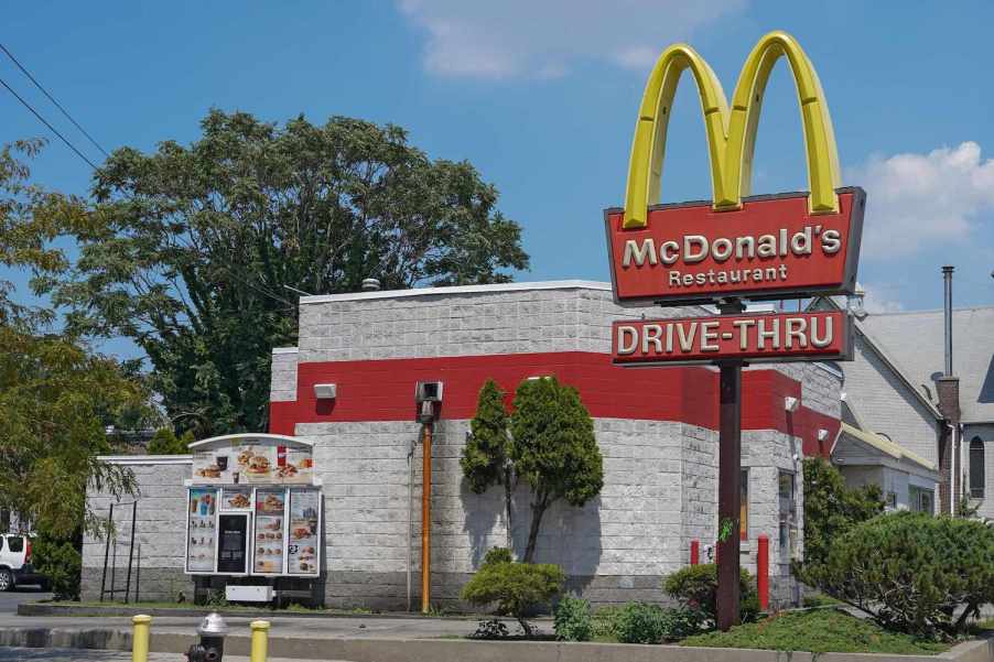 A McDonald's sign over the restaurant's drive-through lane.