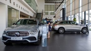 A customer looks at a Mercedes-Benz Group AG GLC 300e Couple vehicle inside the company's showroom in Petaling Jaya, Selangor, Malaysia. The Mercedes-Benz GLC price changes when it's fully equipped.