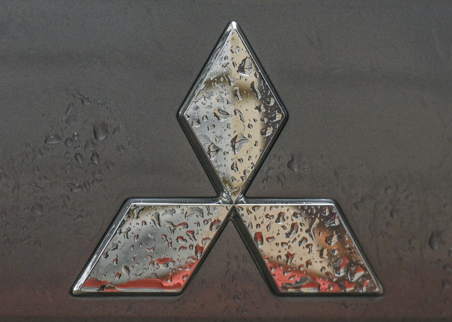 Mitsubishi logo seen on Mitsubishi vehicle parked in Krakow center. Mitsubishi sales aren't setting the world on fire.