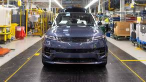 A gray Land Rover Range Rover in production. Range Rover owners love several things about their SUV.