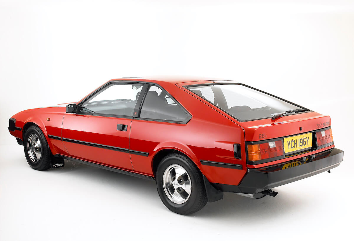 A rear view of a red Toyota Celica Supra