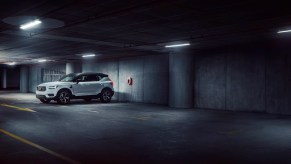 A silver Volvo XC40 parked in a dark parking garage. Volvo XC40 sales are outdone by quite a few models.