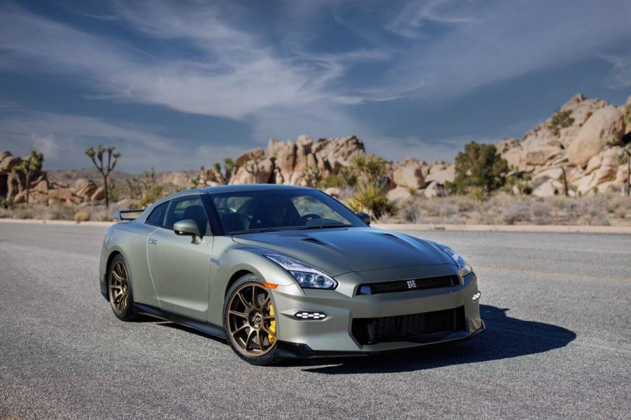 A 2024 Nissan GT-R T-Spec sports car coupe model parked on a empty asphalt road in the desert