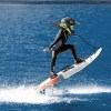 Surfer riding Cyrusher Thunder 54-inch electric surfboard