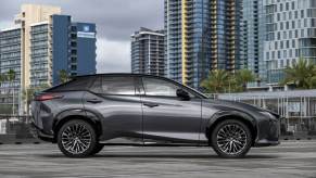 A side profile shot of a 2023 Lexus RZ 450e Luxury AWD all-electric luxury SUV model