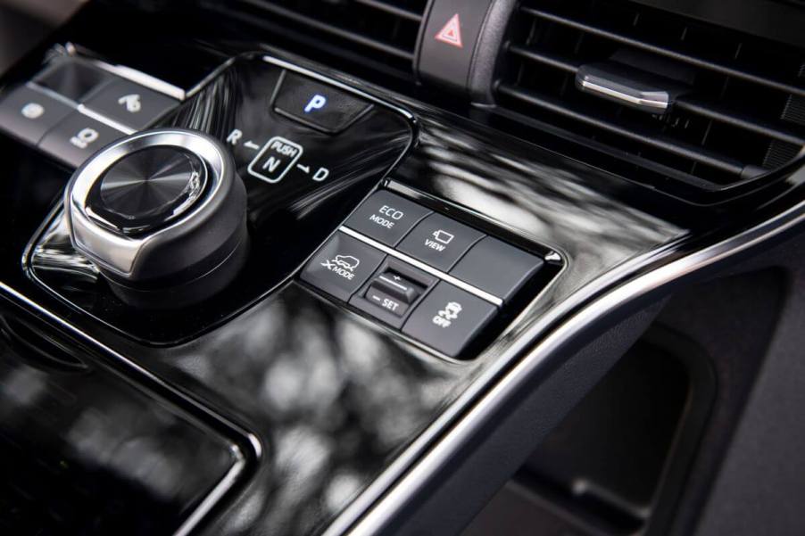 The interior of a 2023 Toyota bZ4X electric compact SUV model featuring its transmission gear selector module