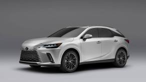 A promotional shot of a 2024 Lexus RX 350 Premium trim midsize luxury SUV model against a gray background