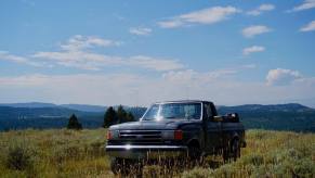 A sub-$2,000 used pickup truck parked on a mountaintop in Wyoming.