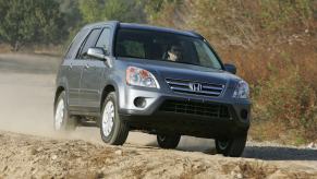 2006 Honda CR-V driving on a dirt road