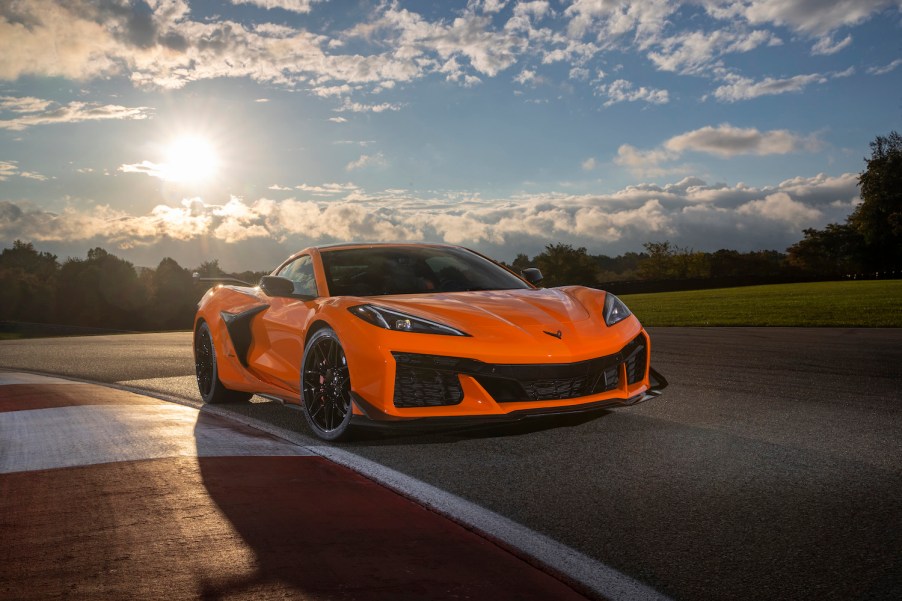 Front view of 2023 Chevrolet Corvette Z06 in Amplify Orange Tint on a track.