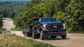 A 2023 Ford F-450 XL Super Duty w/ Max towing trailering capability on display