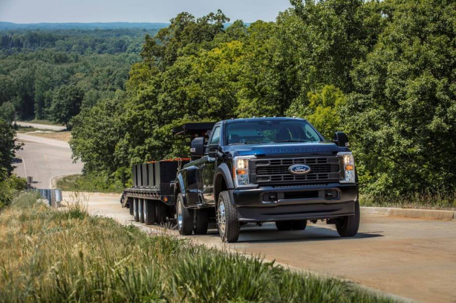 A 2023 Ford F-450 XL Super Duty w/ Max towing trailering capability on display