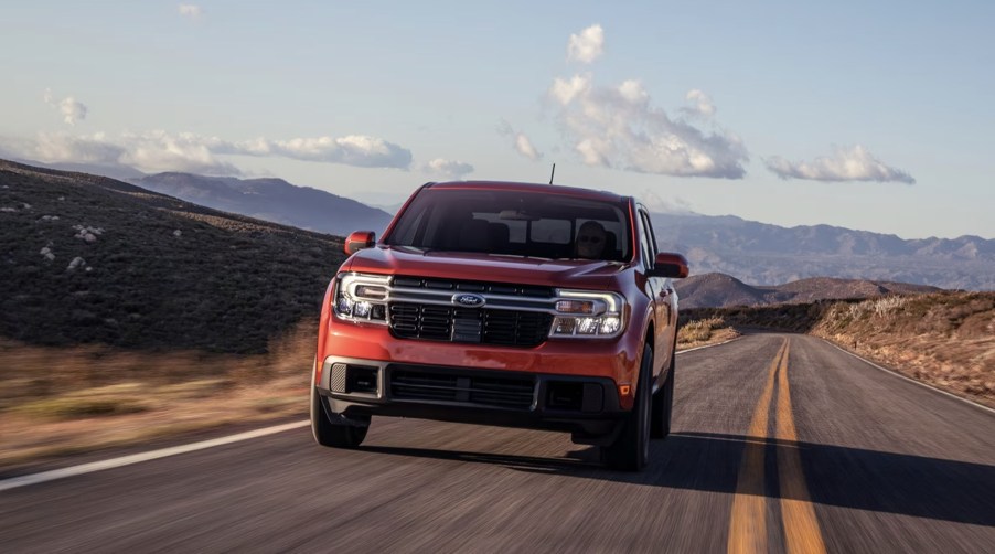 The 2023 Ford Maverick driving on a country road