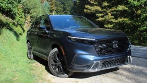 The 2023 Honda CR-V Hybrid parked at a hiking trail