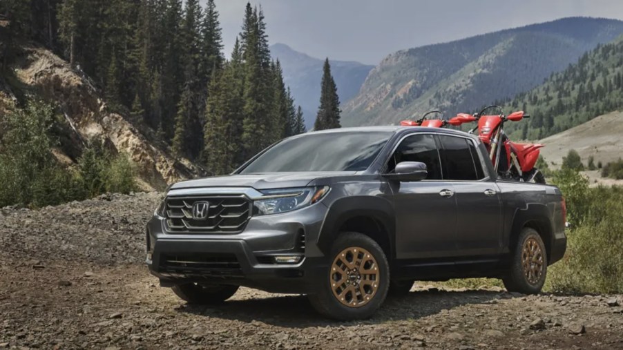 2023 Honda Ridgeline with dirt bikes in the bed