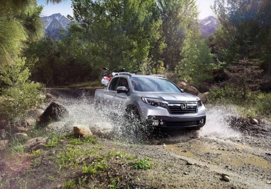 The 2023 Honda Ridgeline off-roading in mud