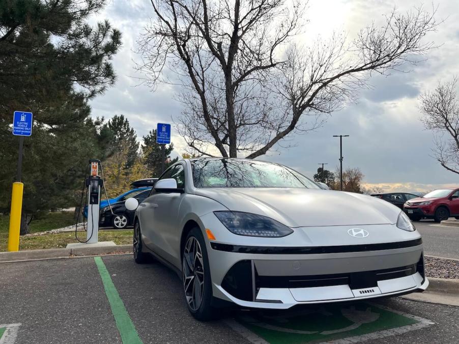 A front view of the 2023 Hyundai Ioniq 6 plugged into a level 2 charger.