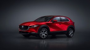 A red 2023 Mazda CX-30 subcompact SUV is parked.