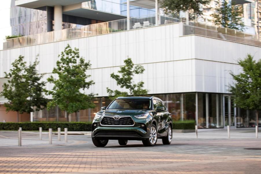 The front of a green 2023 Toyota Highlander. Toyota sales for the Highlander are worse than the Corolla.