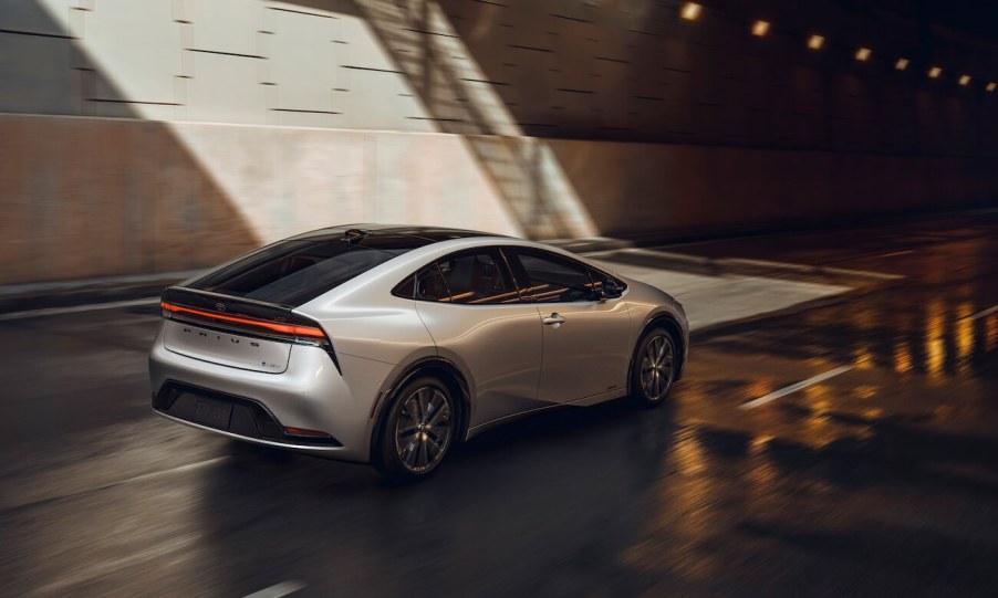 A silver 2023 Toyota Prius rear shot as it enters a tunnel. The Prius was the first model to be a popular hybrid before the new Toyota EV.