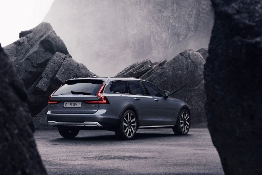 A exterior rear shot of a 2023 Volvo V90 Cross Country executive estate wagon model in Thunder Grey