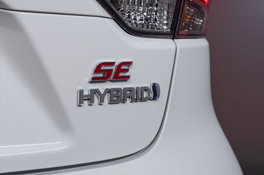 A white 2023 Toyota Corolla Hybrid on display.