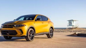 A yellow 2024 Dodge Hornet small SUV is parked.