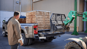 A 2024 Ford F-250 Super Duty Limited heavy-duty pickup truck model having its bead fitted with a payload box