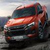 Red 2024 Isuzu D-Max EV pickup on rocks