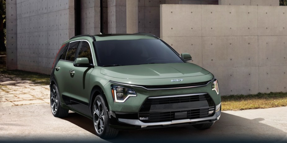 A green 2024 Kia Niro subcompact SUV is parked. 