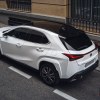 Overhead shot of a white 2024 Lexus UX Hybrid, the cheapest Lexus SUV for 2024.