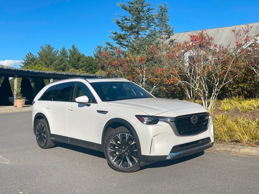 The 2024 Mazda CX-90 PHEV parked near foliage