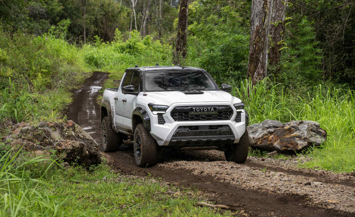 The 2024 Toyota Tacoma Trailhunter truck in the mud