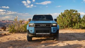 A front-view of a blue 2024 Toyota Land Cruiser.