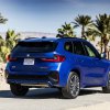 The cheapest BMW SUV, the BMW X1, pictured parked in blue on a sunny day.