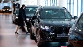 A BMW X3 M sports utility vehicle (SUV) on display at a BMW AG showroom. BMW X3 sales are down.