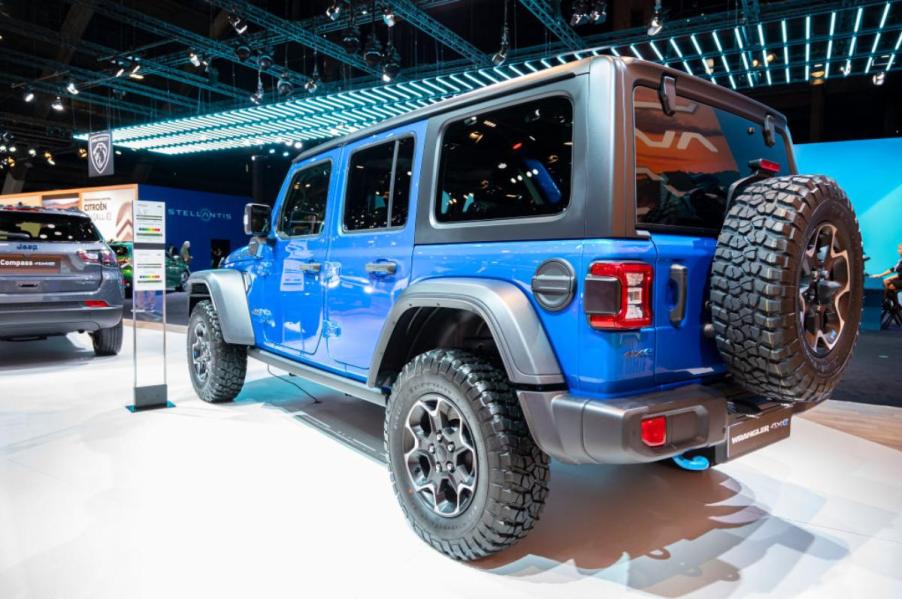 A blue Jeep Wrangler 4xe on display.