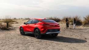 Rear view of the 2024 Buick Envista SUV in Sunrise Red Metallic