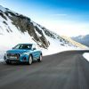 The Audi Q3 driving on a mountain road