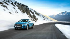 The Audi Q3 driving on a mountain road