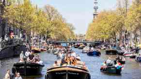 The annual "King's Day" boat parade through the canals of Amsterdam in the Netherlands.