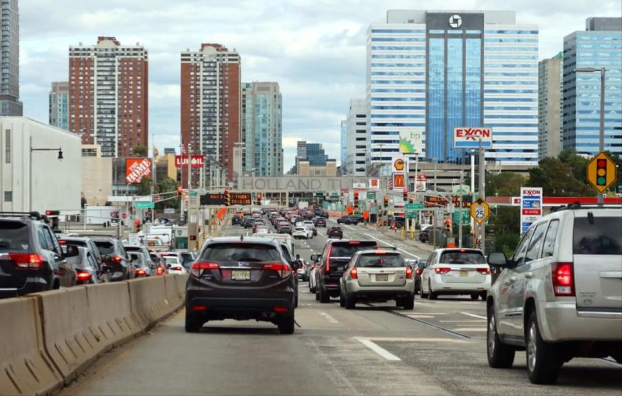 A series of daily driver cars, including compact AWD SUVs and cheap used cars, drive on the highway in New Jersey.