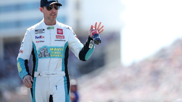 Denny Hamlin waves to fans