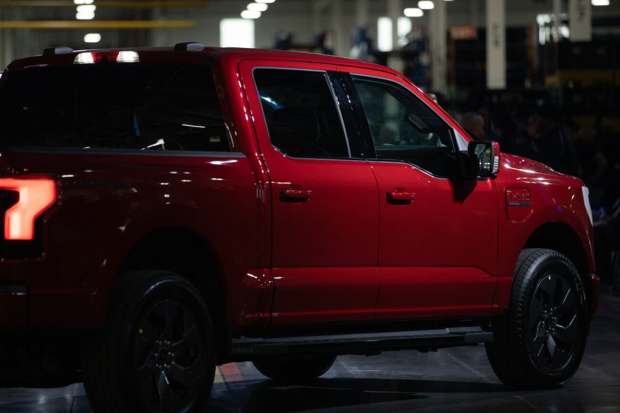 The rear view of a Ford F-150 Lightning at the unveil event. The Ford F-150's price is leading to outrageous monthly payments.