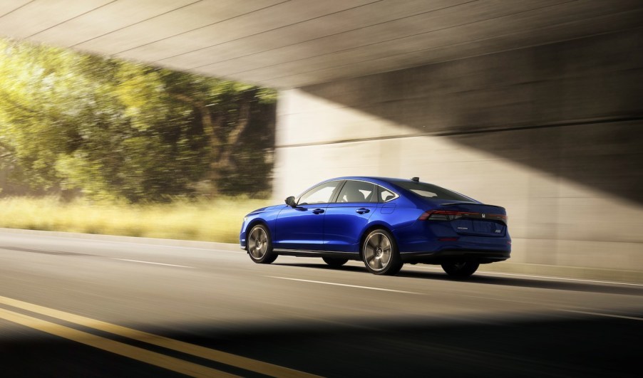 A blue Honda Accord driving underneath an overpass. A fully loaded 2024 Honda Accord isn't in luxury territory.